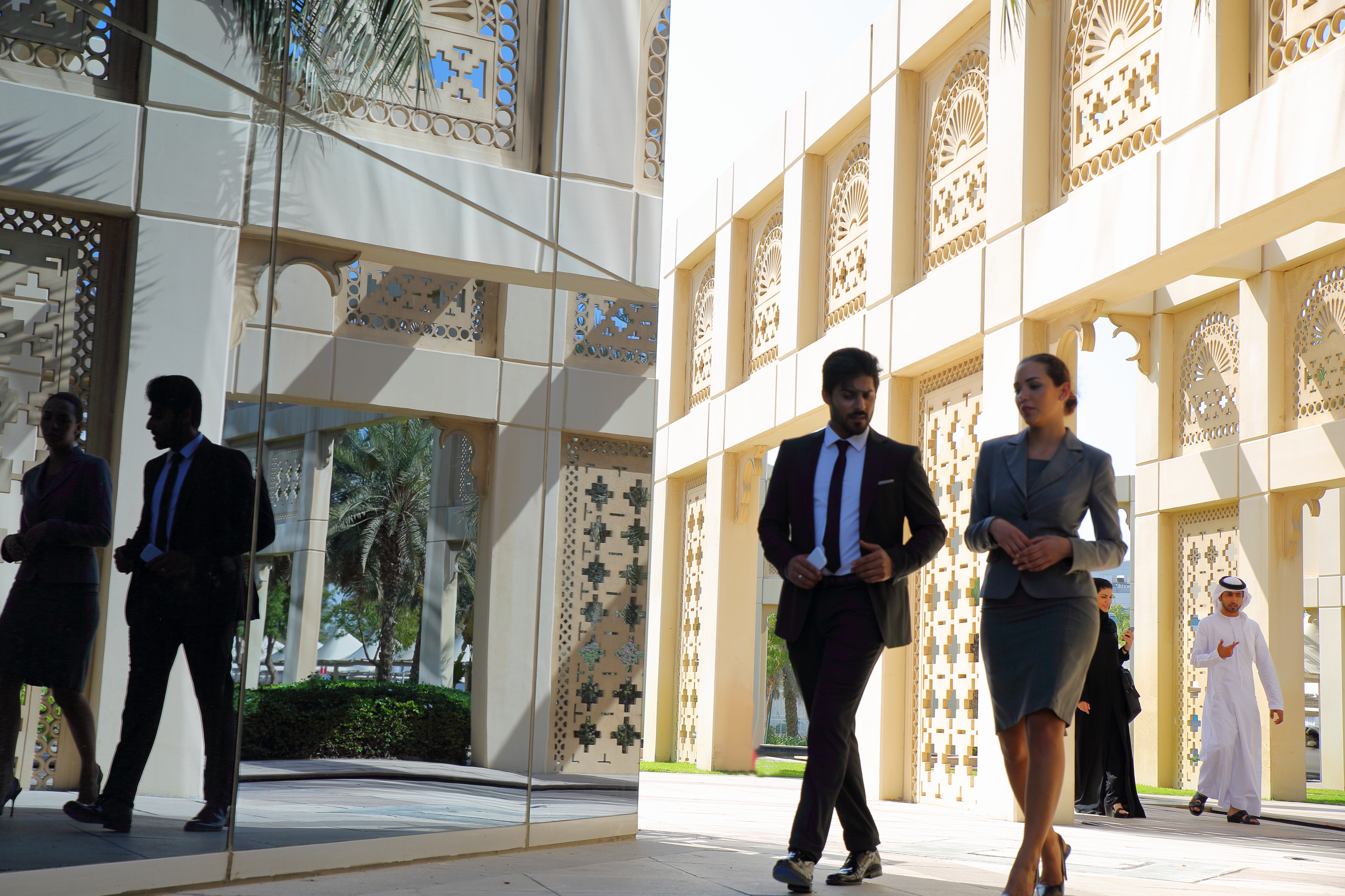 Business professionals in Dubai architectural setting